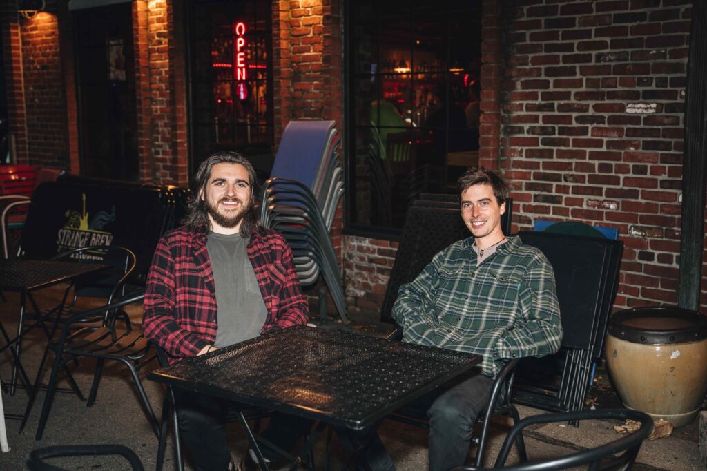 trent and jake outside of strange brew tavern