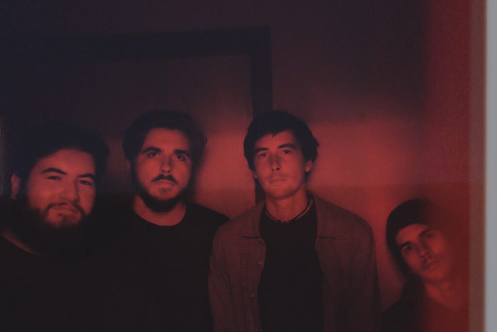 slim volume posing in red light